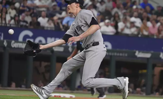 New York Yankees starting pitcher Max Fried fields a groundout hit by Texas Rangers' Sam Haggerty during the fourth inning of a baseball game, Monday, Aug. 4, 2025, in Arlington, Texas. (AP Photo/LM Otero)