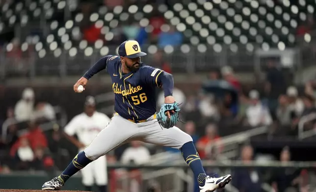 Milwaukee Brewers pitcher Grant Anderson (56) works against the Atlanta Braves in the ninth inning of a baseball game, Tuesday, Aug. 5, 2025, in Atlanta. (AP Photo/Mike Stewart)