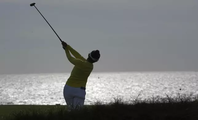 Miyu Yamashita of Japan plays a shot from the 14th fairway during the final round of the Women's British Open golf championship, at Royal Porthcawl Golf Club in Porthcawl, Wales, Sunday, Aug. 3, 2025. (AP Photo/Kin Cheung)