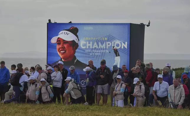 A screen displays a image of Miyu Yamashita of Japan as the new winner of the Women's British Open golf championship, at Royal Porthcawl Golf Club in Porthcawl, Wales, Sunday, Aug. 3, 2025. (AP Photo/Kin Cheung)
