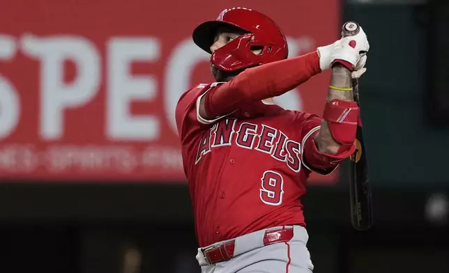 Los Angeles Angels' Zach Neto follows through on a solo home run against the Texas Rangers in the ninth inning of a baseball game, Tuesday, Aug. 26, 2025, in Arlington, Texas. (AP Photo/Tony Gutierrez)