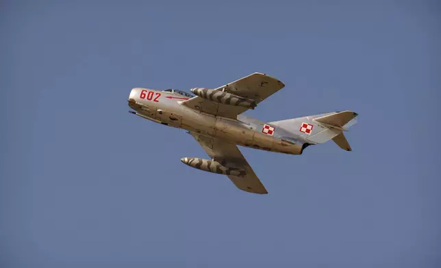 An MIG-15 fighter jet from Poland flies above the runway of the Aurel Vlaicu airport, on the first day of the Bucharest International Air Show, BIAS, in Bucharest, Romania, Saturday, Aug. 30, 2025. (AP Photo/Andreea Alexandru)