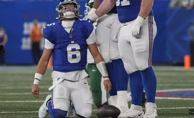 New York Giants quarterback Jaxson Dart (6) reacts after being sacked by the New York Jets during the second quarter of an NFL football game, Saturday, Aug. 16, 2025, in East Rutherford, N.J. (AP Photo/Pamela Smith)