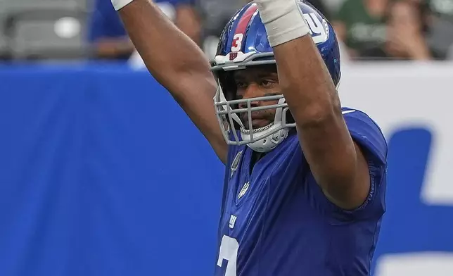 New York Giants quarterback Russell Wilson (3) reacts after a touchdown against the New York Jets during the first quarter of an NFL football game, Saturday, Aug. 16, 2025, in East Rutherford, N.J. (AP Photo/Pamela Smith)