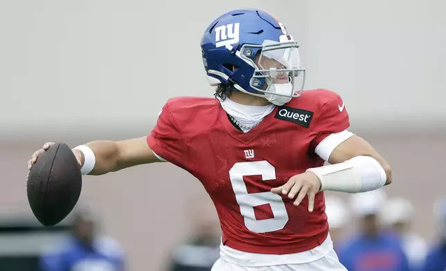 New York Giants quarterback Jaxson Dart (6) passes the ball during Back Together Weekend at the team's NFL football training camp, Sunday, July 27, 2025, in East Rutherford, N.J. (AP Photo/Adam Hunger)