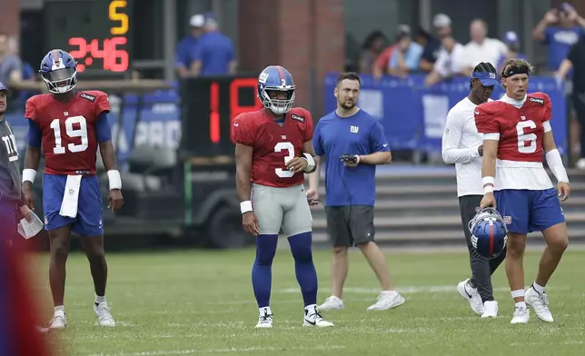 New York Giants quarterbacks Russell Wilson (3), Jameis Winston (19) and Jaxson Dart (6) look on during Back Together Weekend at the team's NFL football training camp, Sunday, July 27, 2025, in East Rutherford, N.J. (AP Photo/Adam Hunger)