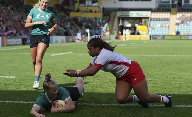 Ireland's Dannah O'Brien scores her side's first try during the group C match at the 2025 Women's Rugby World Cup between Ireland and Spain, at Franklin's Gardens, Northampton, England, Sunday, Aug. 31, 2025. (AP Photo/Dave Shopland)