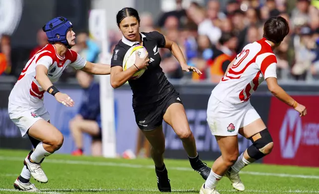 New Zealand's Braxton Sorensen-McGee runs to score a try during the Women's Rugby World Cup 2025 Pool C match between Japan and New Zealand at Sandy Park, Exeter, England, Sunday Aug. 31, 2025. (Ben Birchall/PA via AP)