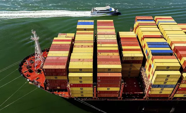 Cargo containers fill a ship at the Port of Oakland on Wednesday, Aug. 6, 2025, in Oakland, Calif. (AP Photo/Noah Berger)