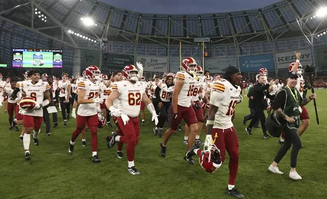 Iowa State players celebrate after winning an NCAA college football game between Iowa State and Kansas State in Dublin, Ireland Saturday, Aug. 23, 2025. (AP Photo/Peter Morrison)