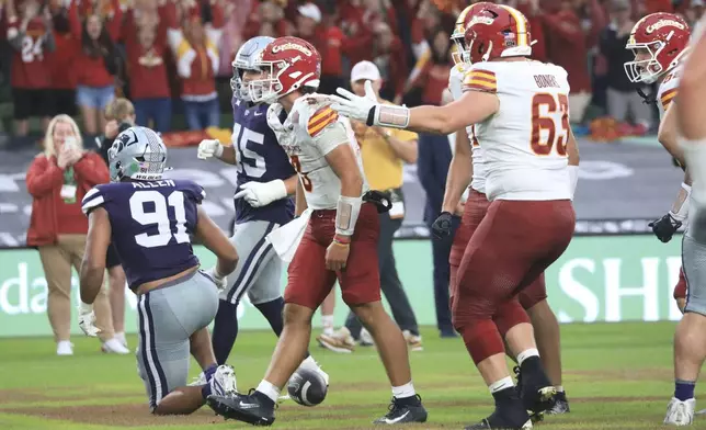 Iowa State Rocco Becht celebrates after scoring a touchdown during an NCAA college football game between Iowa State and Kansas State in Dublin, Ireland Saturday, Aug. 23, 2025. (AP Photo/Peter Morrison)