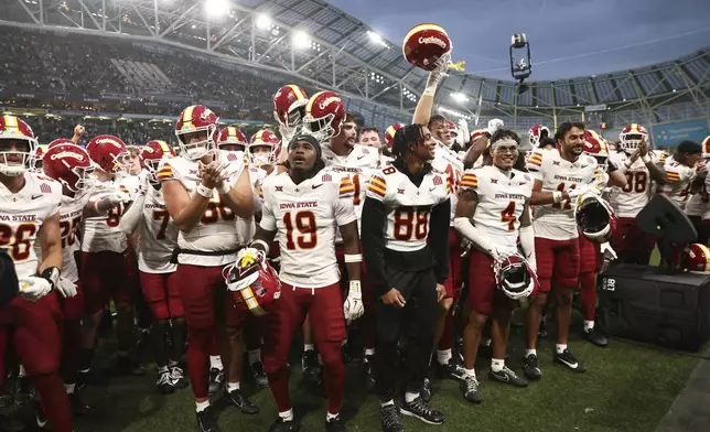 Iowa State players celebrate after winning an NCAA college football game between Iowa State and Kansas State in Dublin, Ireland Saturday, Aug. 23, 2025. (AP Photo/Peter Morrison)