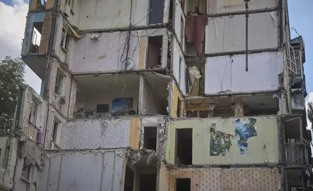 A view on the multistory residential house that was hit by the Russian missile Thursday night, in Kyiv, Ukraine, Friday, Aug. 1, 2025. (AP Photo/Efrem Lukatsky)