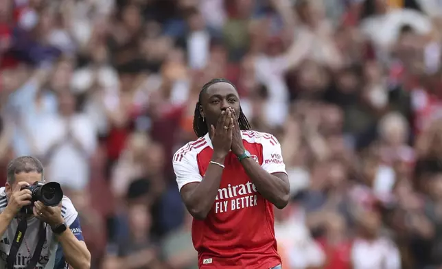 Arsenal's new player Eberechi Eze is introduced to the fans before the English Premier League soccer match between Arsenal and Leeds United at Emirates stadium in London, England, Saturday, Aug. 23, 2025. (AP Photo/Ian Walton)