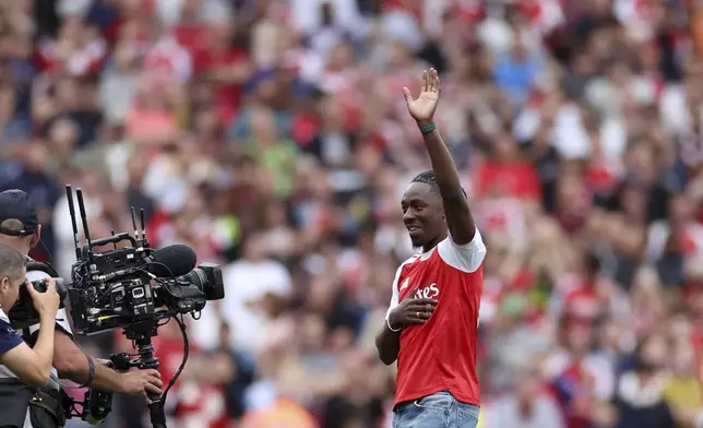 Arsenal's new player Eberechi Eze is introduced to the fans before the English Premier League soccer match between Arsenal and Leeds United at Emirates stadium in London, England, Saturday, Aug. 23, 2025. (AP Photo/Ian Walton)