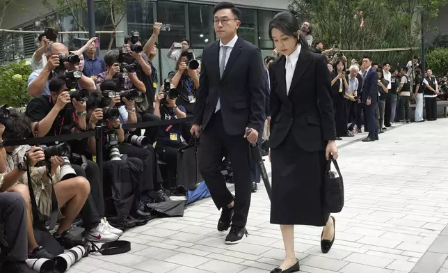 Kim Keon Hee, right, the wife of South Korea's ousted former President Yoon Suk Yeol, arrives at the special prosecutor's office in Seoul, South Korea, Wednesday, Aug. 6, 2025. (AP Photo/Ahn Young-joon)