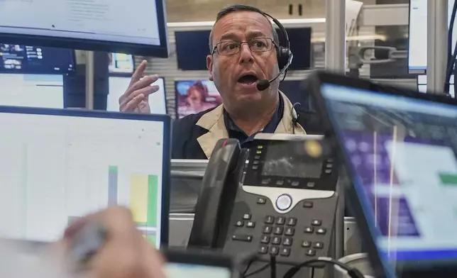 Options traderMatthew Hefner works on the floor of the New York Stock Exchange, Monday, Aug. 18, 2025. (AP Photo/Richard Drew)