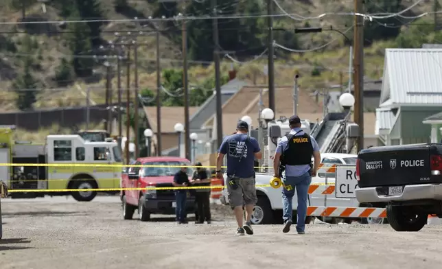 Police and other emergency personnel are seen after a reported shooting in Anaconda, Mont., Friday, Aug. 1, 2025. (Joseph Scheller/The Montana Standard via AP)