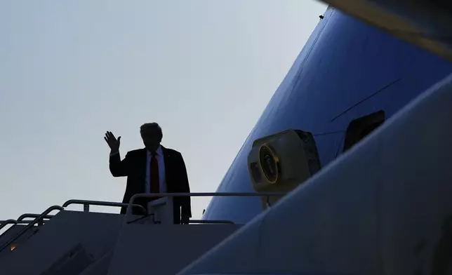 President Donald Trump waves as he boards Air Force One, Friday, Aug. 15, 2025, at Joint Base Andrews, Md. President Trump is traveling to a meeting with Russian President Vladimir Putin today in Alaska at a U.S. military base for a crucial summit. (AP Photo/Julia Demaree Nikhinson)