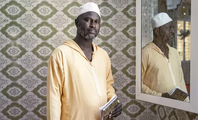 Imam Ibrahima Diane, advocate for gender equality and an end to harmful practices like FGM and gender-based violence, poses for a photograph before the start of his sermon at the Great Mosque of Nietty Mbar in Thiaroye, a suburb of Dakar, Senegal, Friday, July 4, 2025.(AP Photo/Sylvain Cherkaoui)