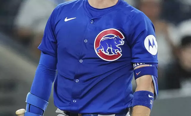 Chicago Cubs' Carson Kelly (15) reacts after striking out with the bases loaded against the Toronto Blue Jays during third inning MLB baseball action in Toronto on Tuesday, August 12, 2025. (Nathan Denette/The Canadian Press via AP)