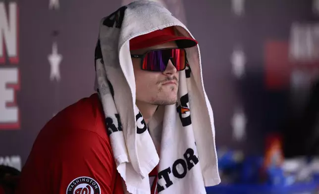 Washington Nationals' Brady House looks on from the dugout during a baseball game against the Milwaukee Brewers, Sunday, Aug. 3, 2025, in Washington. (AP Photo/Nick Wass)