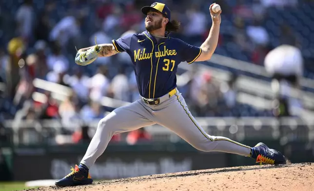 Milwaukee Brewers relief pitcher DL Hall (37) throws during the seventh inning of a baseball game against the Washington Nationals, Sunday, Aug. 3, 2025, in Washington. (AP Photo/Nick Wass)