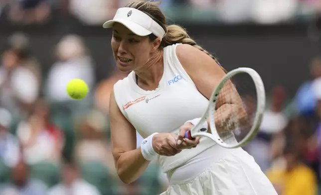 FILE - Danielle Collins of the U.S. returns to Iga Swiatek of Poland during a third round women's singles match at the Wimbledon Tennis Championships in London, Saturday, July 5, 2025. (AP Photo/Kirsty Wigglesworth, file)