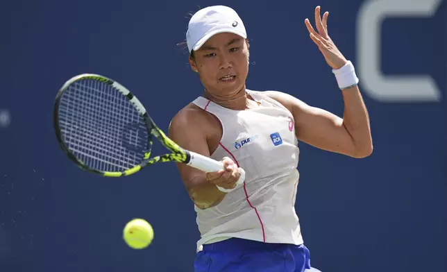Janice Tjen, of Indonesia, returns a shot to Veronika Kudermetova, of Russia, during the first round of the US Open tennis championships, Sunday, Aug. 24, 2025, in New York. (AP Photo/Frank Franklin II)