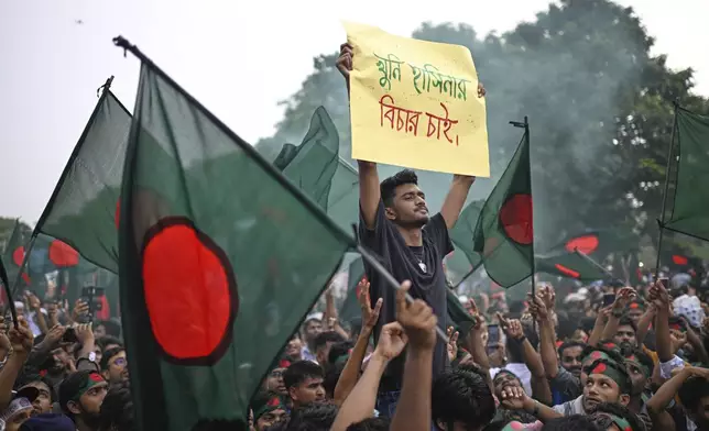 Students and locals shout slogans as they gather to commemorate "July Uprising Day" marking the anniversary of the fall of the Awami League government, in Dhaka, Bangladesh, Tuesday, Aug. 5, 2025. (AP Photo/Mahmud Hossain Opu)