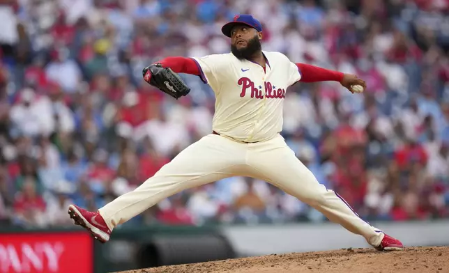 Philadelphia Phillies' José Alvarado pitches during the eighth inning of a baseball game against the Seattle Mariners Wednesday, Aug. 20, 2025, in Philadelphia. (AP Photo/Matt Slocum)