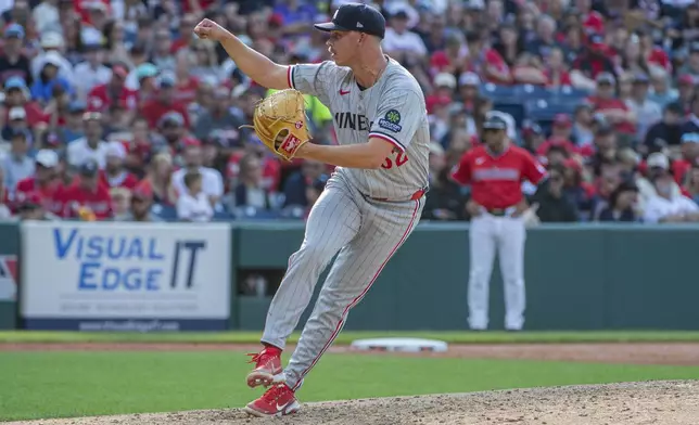 Minnesota Twins relief pitcher Pierson Ohl delivers against the Cleveland Guardians during the sixth inning of a baseball game, Saturday, Aug. 2, 2025, in Cleveland. (AP Photo/Phil Long)
