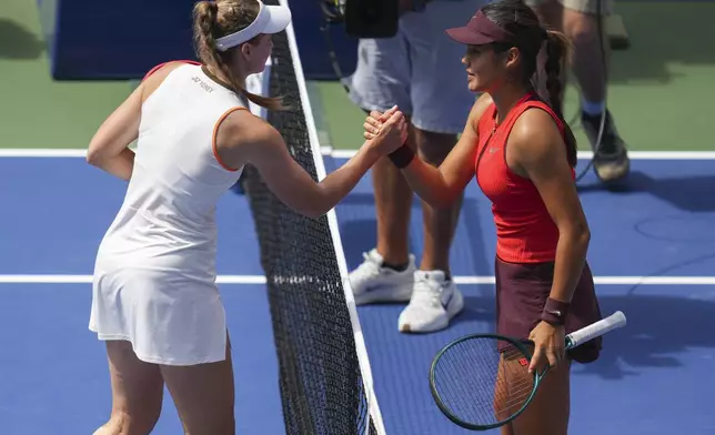 Elena Rybakina, of Kazakhstan, shakes hands with Emma Raducanu, of Great Britain, after winning their third-round match of the U.S. Open tennis championships, Friday, Aug. 29, 2025, in New York. (AP Photo/Kirsty Wigglesworth)