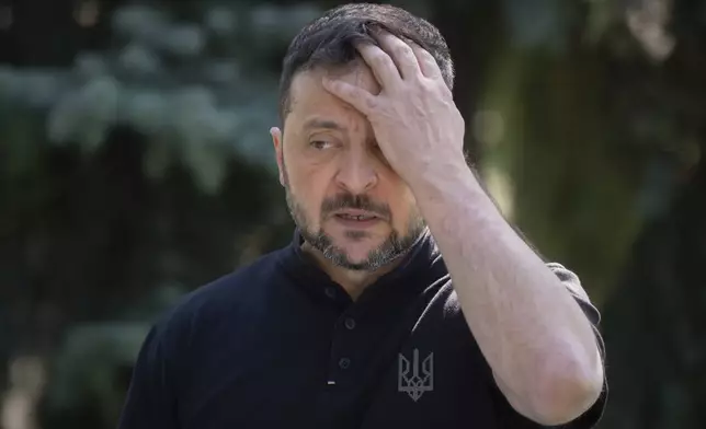 Ukrainian President Volodymyr Zelenskyy reacts during his press conference in Kyiv, Ukraine, Friday, Aug. 29, 2025. (AP Photo/Efrem Lukatsky)