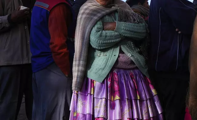 Voters stand in line at a polling station during general elections in Jesus de Machaca, Bolivia, Aug. 17, 2025. (AP Photo/Juan Karita)