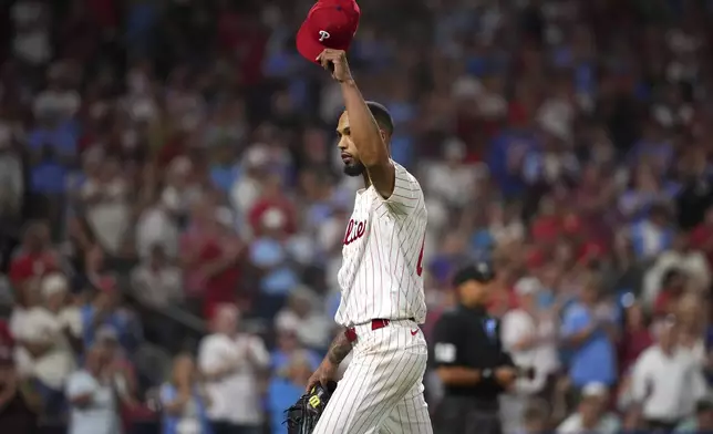 Philadelphia Phillies pitcher Cristopher Sánchez reacts after being pulled during the seventh inning of a baseball game against the Seattle Mariners Tuesday, Aug. 19, 2025, in Philadelphia. (AP Photo/Matt Slocum)