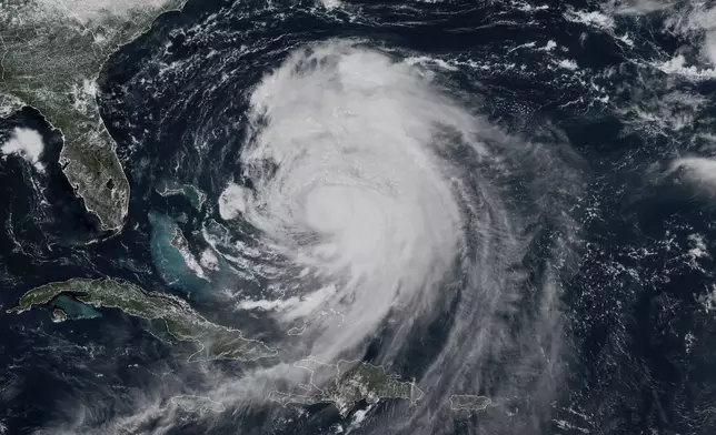 This GOES-19 GeoColor satellite image taken Tuesday, Aug. 19, 2025 at 1:20 p.m. EDT and provided by NOAA, shows Hurricane Erin churning slowly toward the eastern U.S. coast. (NOAA via AP)