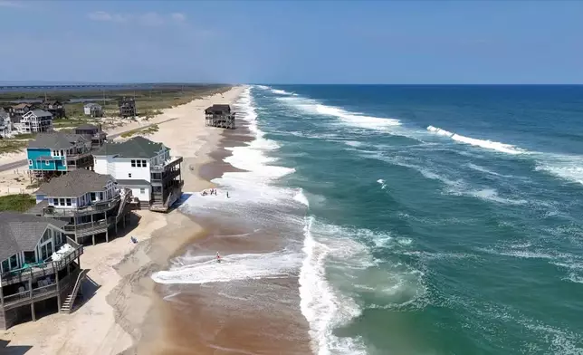 In this aerial image taken from video provided by WVEC-TV, homes along the Atlantic Coast in Dare County, N.C., are seen, Monday, Aug. 18, 2025, ahead of expected impacts from Hurricane Erin. (WVEC-TV via AP)