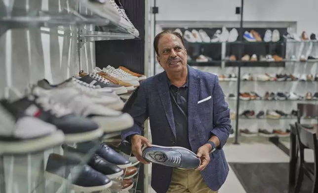 Puran Dawar, Chairman, Dawar group, ań exporter of leather footwear talks to The Associated Press, in Agra, India, Monday, Aug. 25, 2025. (AP Photo/Manish Swarup)