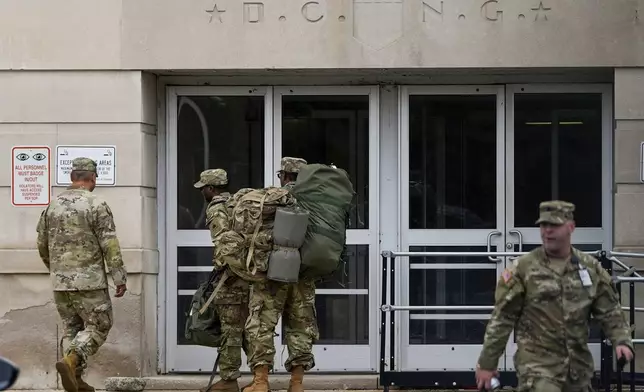 National Guard troops arrive at the District of Columbia National Guard Headquarters, Tuesday, Aug. 12, 2025, in Washington. (AP Photo/Julia Demaree Nikhinson)