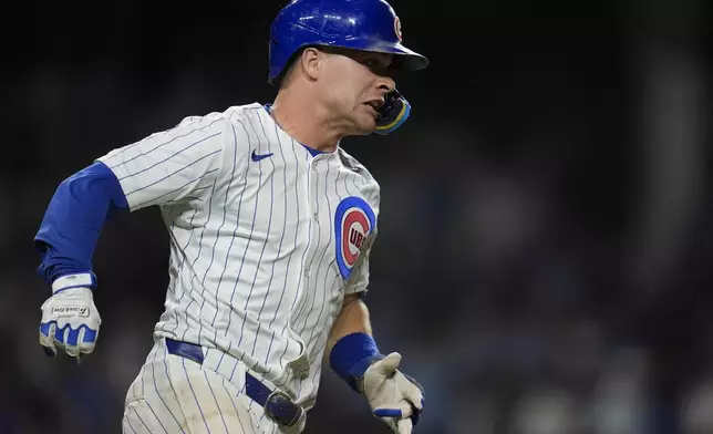 Chicago Cubs' Matt Shaw (6) runs the bases after hitting a triple during the sixth inning of the second baseball game of a split doubleheader against the Milwaukee Brewers, Tuesday, Aug. 19, 2025, in Chicago. (AP Photo/Erin Hooley)
