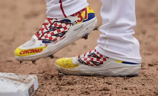 Cincinnati Reds' Tyler Stephenson stands on first during the eighth inning of the MLB Speedway Classic baseball game against the Atlanta Braves at Bristol Motor Speedway in Bristol, Tenn., Sunday, Aug. 3, 2025. Play was resumed today after yesterday's weather delay. (AP Photo/George Walker IV)