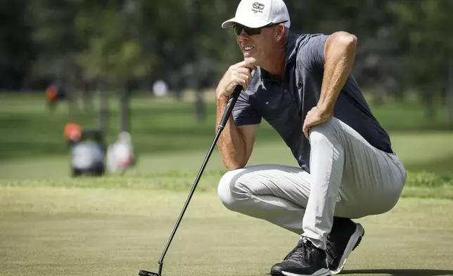 Australia's Richard Green lines up a putt on the seventh green during the final round at the PGA Tour Champions golf tournament in Calgary, Alberta, Sunday, Aug. 17, 2025. (Jeff McIntosh/The Canadian Press via AP)