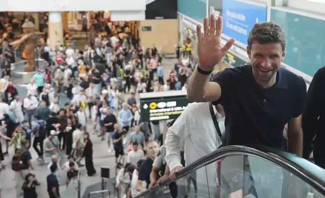 New Vancouver Whitecaps player Thomas Muller arrives from Germany at Vancouver International Airport in Richmond, British Columbia, Wednesday, Aug. 13, 2025. (Darryl Dyck/The Canadian Press via AP)