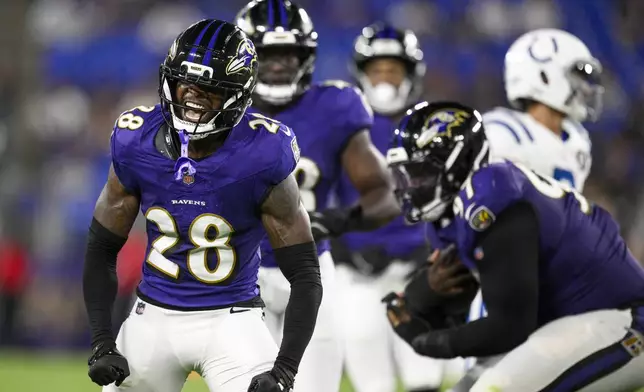 Baltimore Ravens cornerback Marquise Robinson (28) reacts after making a hit on Indianapolis Colts running back Ulysses Bentley IV, not visible, during the second half of an NFL preseason football game Thursday, Aug. 7, 2025, in Baltimore. (AP Photo/Nick Wass)