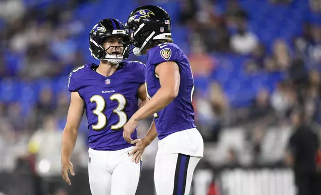 Baltimore Ravens place kicker Tyler Loop (33) talks with holder Jordan Stout after kicking a field goal against the Indianapolis Colts during the second half of an NFL preseason football game Thursday, Aug. 7, 2025, in Baltimore. (AP Photo/Nick Wass)