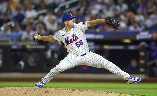 New York Mets starting pitcher Ryan Helsley throws during the 10th inning of a baseball game against the Cleveland Guardians at Citi Field in New York, Monday, Aug. 4, 2025. (Gordon Donovan via AP)