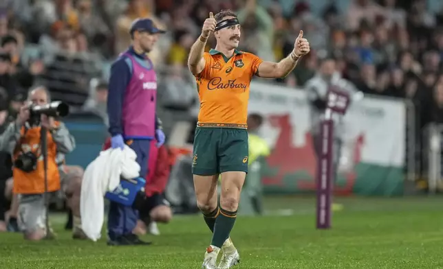 Australia's Nic White gestures as he leaves the pitch after being substituted during the third and final rugby union test between the Lions and the Wallabies in Sydney, Australia, Saturday, Aug. 2, 2025. (AP Photo/Rick Rycroft)