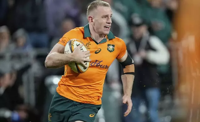 Australia's Max Jorgensen races in to score a try during the third and final rugby union test between the Lions and the Wallabies in Sydney, Australia, Saturday, Aug. 2, 2025. (AP Photo/Rick Rycroft)