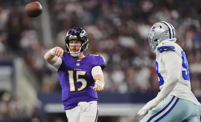 Baltimore Ravens quarterback Cooper Rush (15) throws a pass under pressure from the Dallas Cowboys defense in the first half of a preseason NFL football game Saturday, Aug. 16, 2025, in Arlington, Texas. (AP Photo/LM Otero)